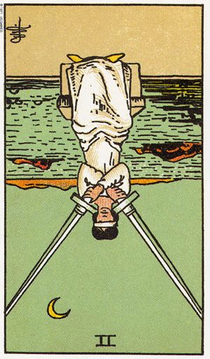 Таро Двійка мечів перевернута